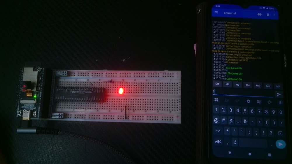 George’s ESP32-WROVER breadboard with a lit LED beside an Android phone displaying Bluetooth LED ON and OFF confirmations.